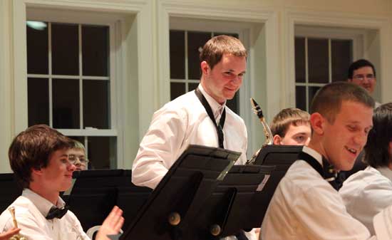 Bromfield graduate Tom Cooke of Depot Road takes a bow after his saxophone solo. 