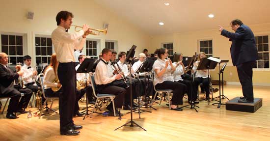 Bromfield graduate Cedric Chandler (standing) of Prospect Hill Road plays a trumpet solo.