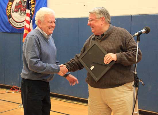 Bill Herbert accepts the Citizen of Note award from Selectman Peter Warren. 