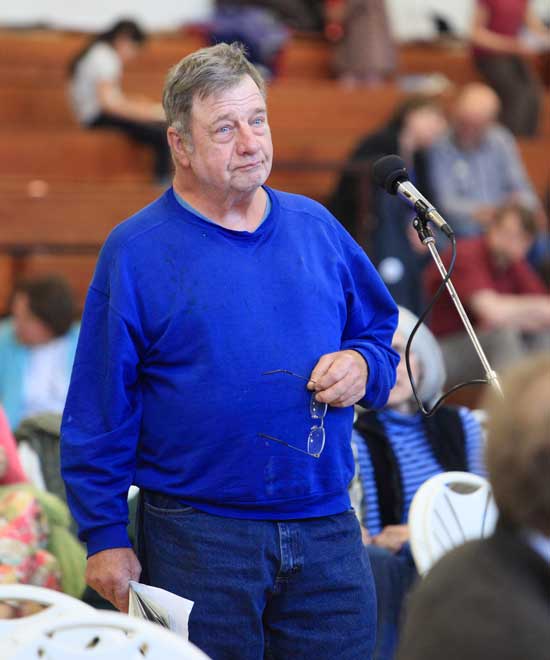 Paul Willard, chairman of the Conservation Commission, states the need to battle invasive species spreading on town conservation land.
