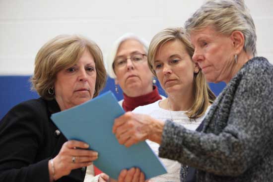 From left: Community Preservation Committee members Rhonda Sprague, Deb Thomson, Michelle Catalina, and Pat Jennings look over their notes.