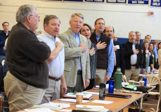 Selectmen recite the Pledge of Allegiance. From left: Peter Warren, Ron Ricci, Bill Johnson, Marie Sobalvarro, Tim Clark, and Town Counsel Mark Lanza. 