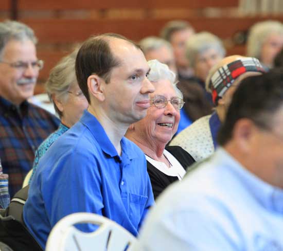 John Shutt  and Elsie Shutt listen as Moderator Bob Eubank pays tribute to Phil Shutt, who passed away in early April. Phil was a longtime member of the Planning Board and was the principal author of Harvard's zoning bylaw.