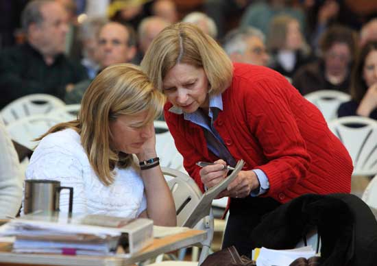 Planning Board member Michelle Catalina (left) confers with Debbie Ricci, Community Preservation Committee member. 