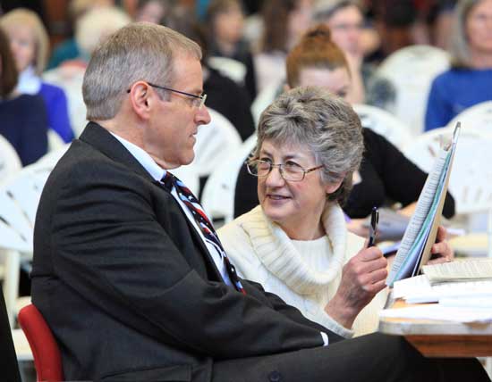 Lucy Wallace confers with Town Administrator Tim Bragan.